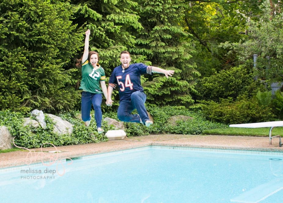 engagement session jumping in the pool