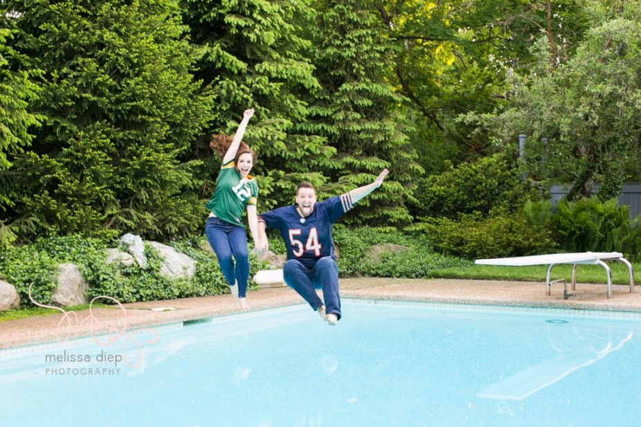 engagement session jumping in the pool